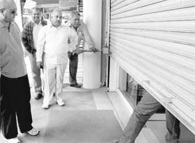 Shopkeepers shut their shops in protest against foreign direct investment (FDI) at Sector 11, Panchkula on Thursday. 