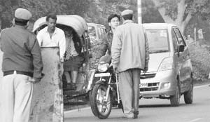 The Cop’s Style: A policeman stops a biker riding without helmet at a check-point at Sector 10, Panchkula, on Thursday.