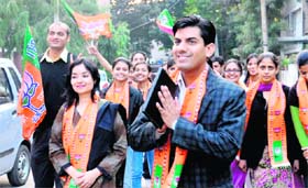 Saurabh Joshi, BJP candidate from ward No. 2, campaigns with his supporters at Sector 15, Chandigarh, on Thursday