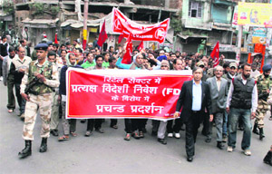Activists of the CPI(M) protest against the FDI in retail sector in Jammu on Thursday