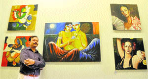Kamal Nath poses with his photographs in Ludhiana on Thursday. 