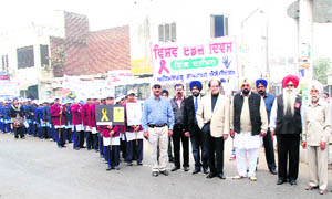 Students take out an awareness rally on AIDS in Mandi Ahmedgarh on Thursday. 