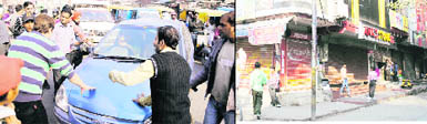 Shopkeepers stop vehicles and (tight) close shops at Pink Plaza in Amritsar