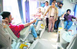 Junior resident doctors of Government Medical College donate blood during their ongoing protest in Amritsar 