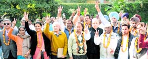 Candidates of the CJM flash the victory sign at Sector 9, Chandigarh, on Friday