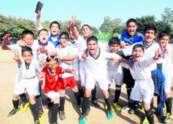 Members of the St Stephens football team rejoice after winning the final at Sector 45, Chandigarh, on Friday