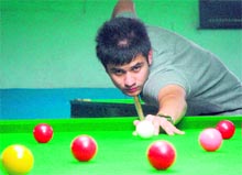 Rahul Sharma aims a shot during the ongoing billiards and snooker championship at Panchkula on Friday