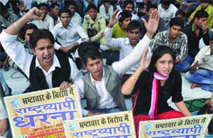 Activists under the banner of the Youth Against Corruption hold a daylong dharna against alleged corruption in the UPA government in New Delhi on Friday