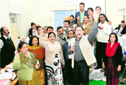 Congress councillors raise slogans at the board meeting of the Dehradun Municipal Corporation on Friday
