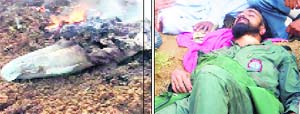 The MiG 21 wreckage in flames after the crash in Sirsa on Friday as pilot Sqn Ldr Jaideep (right) awaits evacuation. 