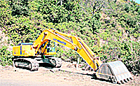 The  R&B Departments earthmover stands idle at the construction site in Jammu on Friday. 