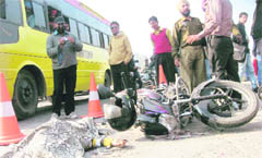 The body of a girl and the mangled remains of a motorcycle that met with an accident in Jalandhar