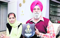 Lt Col JS Lakhman (retd) with his wife in Jalandhar on Friday; and (below) the three generations - Capt Man Singh, Lt Col JS Lakhman and Col Vijay Paul Singh