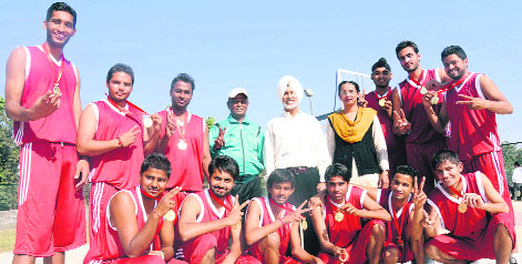 Members of the basketball team of Satish Chander Dhawan Government College for Boys pose with their medals after winning an inter-college championship in Ludhiana on Friday.