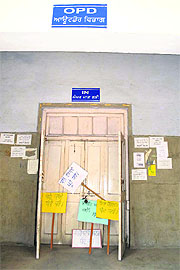 Placards placed by the protesters on the closed doors of an OPD in Rajindra Hospital in Patiala on Friday.