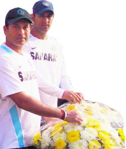Sachin Tendulkar (L) and captain MS Dhoni.  A lot of unnecessary focus will once again be there on Sachins 100th century 