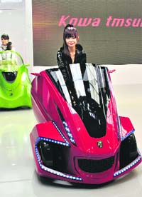 Japan's robot venture Kowa Tmsuk unveils its electric personal mobility Kobot at a press preview of the ongoing Tokyo Motor Show. The ultra compact electric vehicle, with an 18 mph electric transformer that can be controlled with a compatible smartphone, features extensible and collapsible mechanisms for reduced parking space footprint