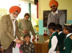 A special kid being given a memento during a programme held to mark the World Disabled Day in Bathinda
