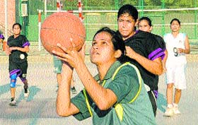 A player of GPGCC aims to score a basket against Sacred Heart School at NPS, Sector 18, Chandigarh, Saturday