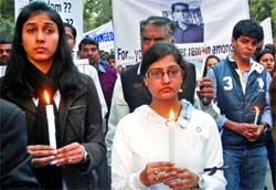 Relatives of Shailaj Roy, who was allegedly beaten to death at a tea stall in Govindpuri last month, take part in a candlelight march to demand justice for him at Jantar Mantar in New Delhi on Saturday