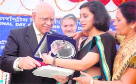 Nirmita Narasimhan receives the NIVH Excellence Award from Justice AS Anand (retd), former chairman of the National Human Rights Commission, on International Day of Persons with Disabilities at the NIVH in Dehradun on Saturday