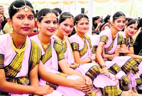 Students of the Bajaj Learning Institute for Special Children wait for their performance at a function held to mark International Day of Persons with Disabilities at the Parade Ground in Dehradun on Saturday
