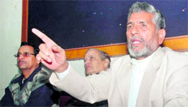 State Revenue Minister Diwakar Bhatt addresses a press conference in Dehradun on Saturday.