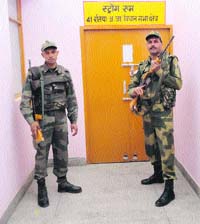 BSF personnel on Saturday guard a strongroom where EVMs of the bypoll have been kept in Ratia