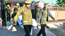 Policemen carry the body of the constable from the house of DSP Daljit Singh in Jammu on Saturday.