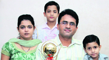 Advocate Ashok Sharma, who runs a marriage bureau for disabled persons, with his wife and sons