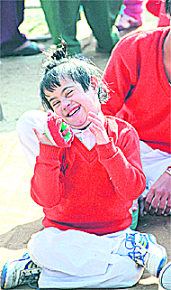 A child is all smiles at a function held to mark World Disability Day in Jalandhar on Saturday.