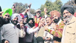 Paramjit Singh Gill (centre) along with his supporters in a jubilant mood after winning the PAU Employees Union election in Ludhiana