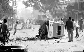 Agitators burn a police jeep in Bhopal on Saturday.