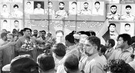 Members of the Pakistani civil society pay tributes to soldiers who were killed in NATO airstrike on November 26, in Lahore on Saturday.