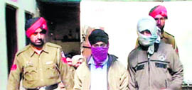 Accused Kamaljit Singh and Sunil Kumar in police custody in Amritsar on Sunday.