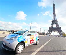 An Autolib' electric car drives next to the Eiffel tower during a presentation ride in Paris. The bubble-shaped vehicle service will be launched in the city on Monday. Users in Paris and Ile de France cities will be able to sign up for daily, weekly or annual memberships ranging from 10 euros to 144 euros, paying according to the length of time the car is used