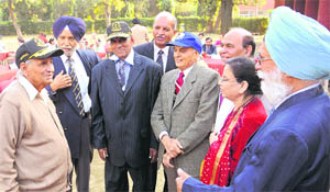 Nek Chand (left) interacts with officers during the Navy Day function at the PGI Club in Sector 24 of Chandigarh on Sunday.