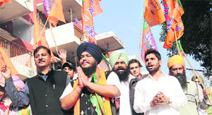 Ward 10 SAD-BJP candidate Malkit SIngh seeks votes at Sector 41 in Chandigarh on Sunday.