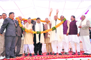 BJP national president Nitin Gadkari, Chief Minister BC Khanduri and other senior state party leaders at a party rally in Dehradun on Sunday.