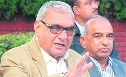 Chief Minister Bhupinder Singh Hooda makes a point at a press conference in Chandigarh on Sunday. 