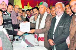 BJP candidate from Renuka Hriday Ram receives the victory certificate from the election officer in Nahan on Sunday.