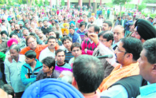 BJP MLA Anil Joshi along with his supporters in Amritsar on Monday. 