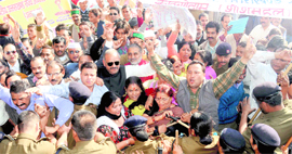 Members of the Uttarakhand Rajya Andolankari Manch being stopped by the police from marching towards the residence of Chief Minister BC Khanduri in Dehradun on Monday.