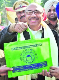 Punjab DGP (Jails) Shashikant shows an education kit to be given to the Central Jail inmates in Patiala on Monday
