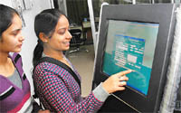 Visitors get familiar with the touch screen installed at the Suwidha Centre in Bathinda
