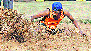 A boy participates in the long jump event of the Idea Junior League Inter-School Sports Championship in Chandigarh on Tuesday. 