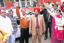 Bhupinder Singh Gill with his supporters after a walkout from the public interaction session at the community centre in Sector 21 of Chandigarh on Tuesday. 