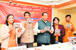 Dehradun Mayor Vinod Chamoli (centre) releases a video album in Dehradun on Tuesday. 
