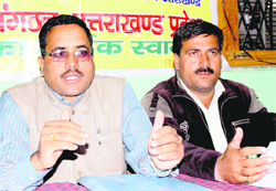 President of Pradhan Sangathan Surat Singh Negi (left) addresses a press conference in Dehradun on Tuesday.