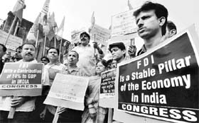 Youth Congress activists take part in a rally in Kolkata to support FDI in retail